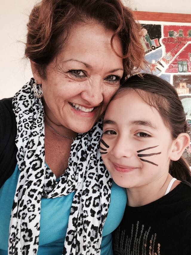 Angie and a young lady posing for a photo